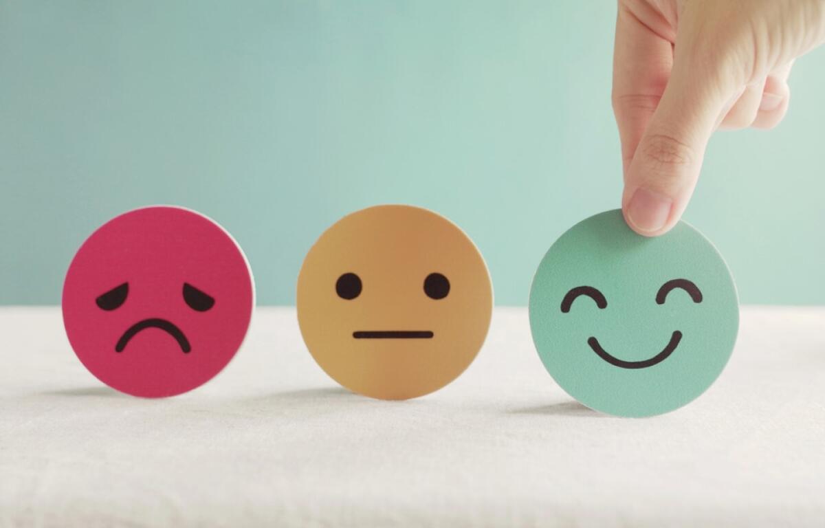 Round circles with drawings of facial expressions