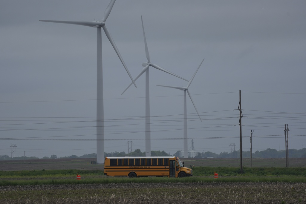 Wind farm with school bus passing through