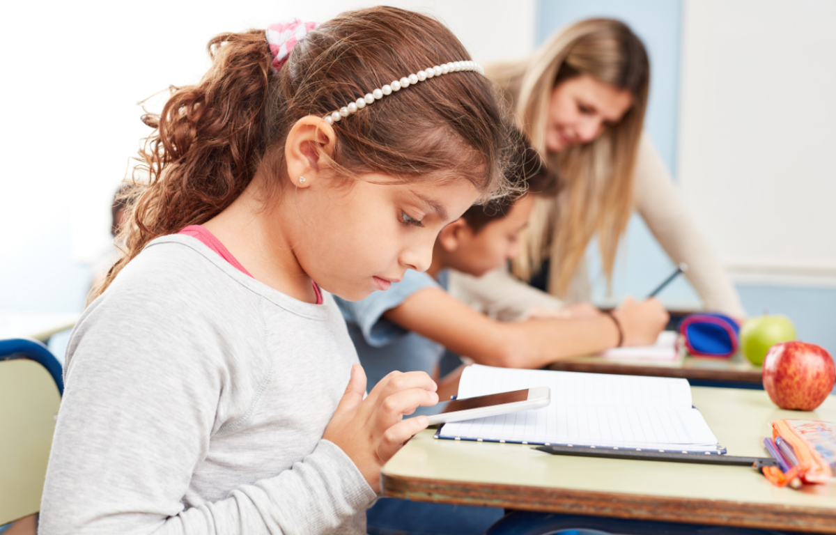 girl on phone in class