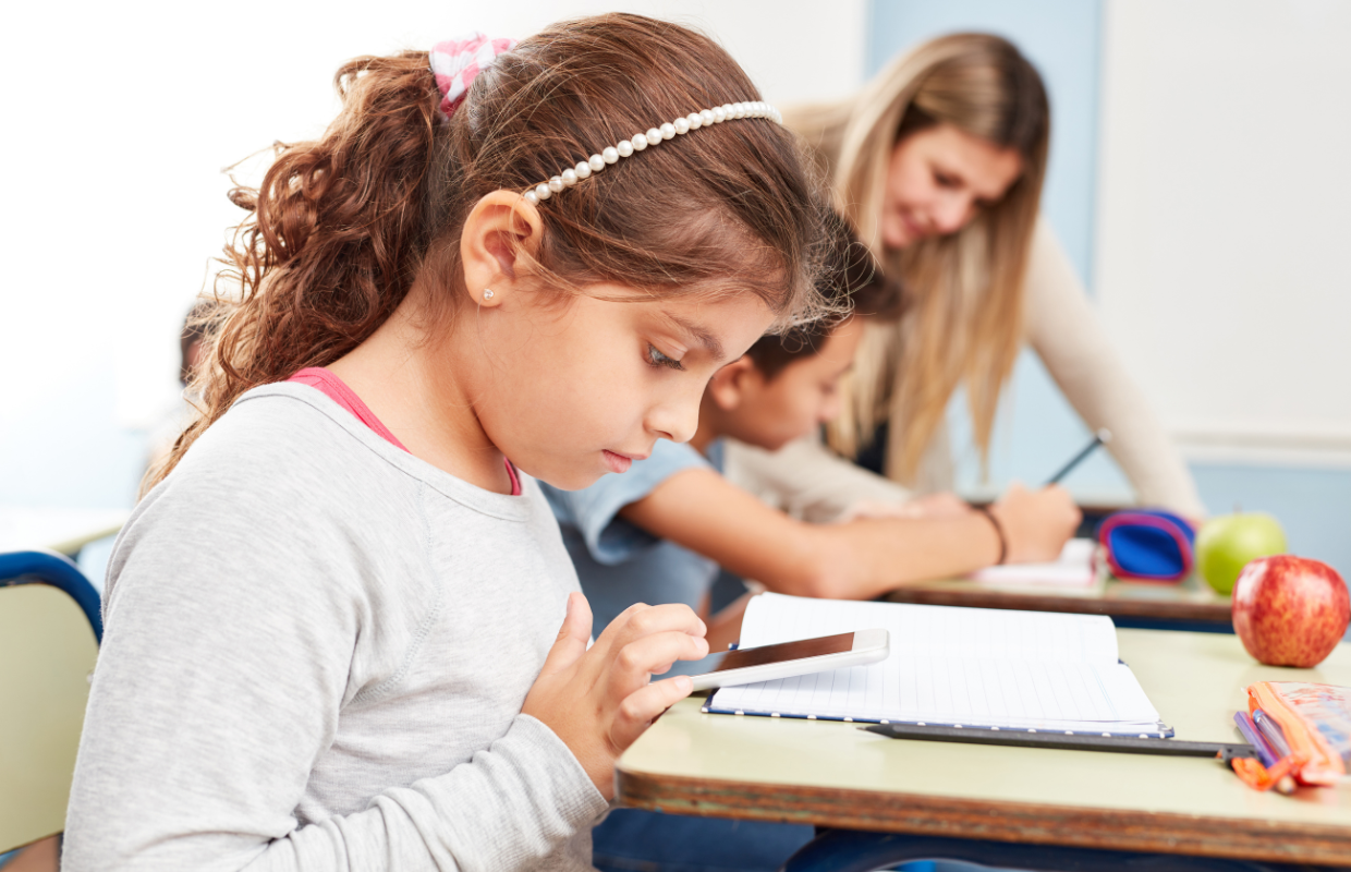 girl on phone in class