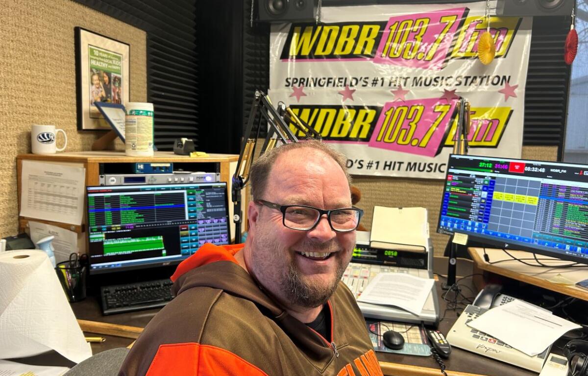 Mikee in WDBR studio with the Weekend Rundown