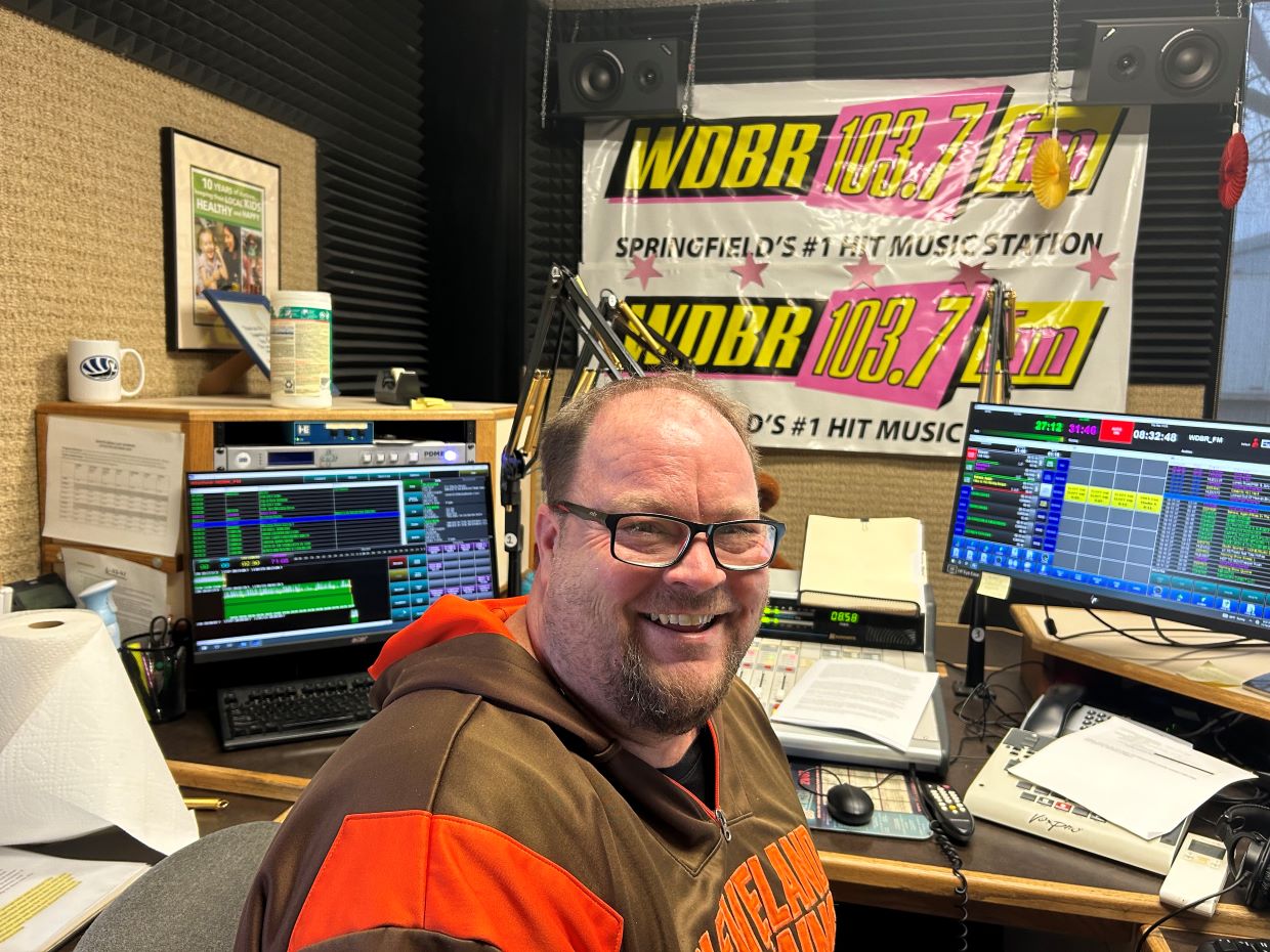 Mikee in WDBR studio with the Weekend Rundown