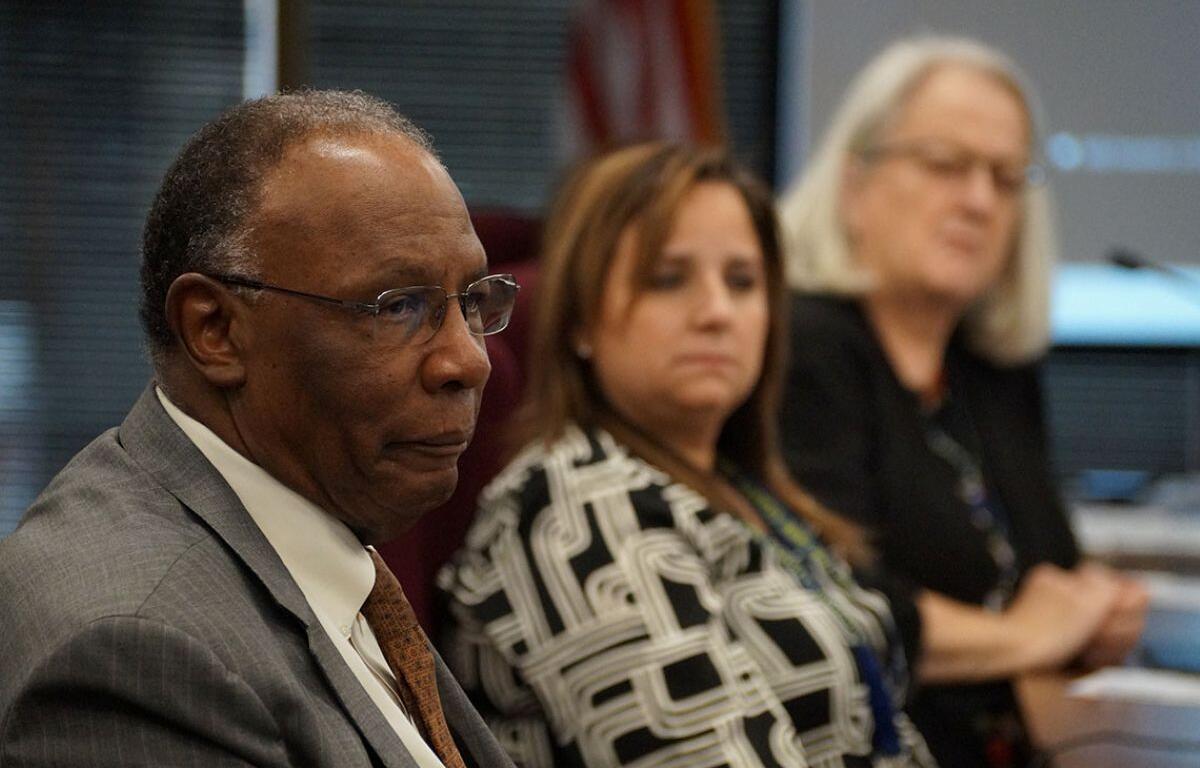 Illinois State Board of Education member James Anderson, left, listens to a presentation about budget challenges for PreK-12 education along with board members Laura Gonzalez and Patricia Nugent. (Capitol News Illinois photo by Peter Hancock)