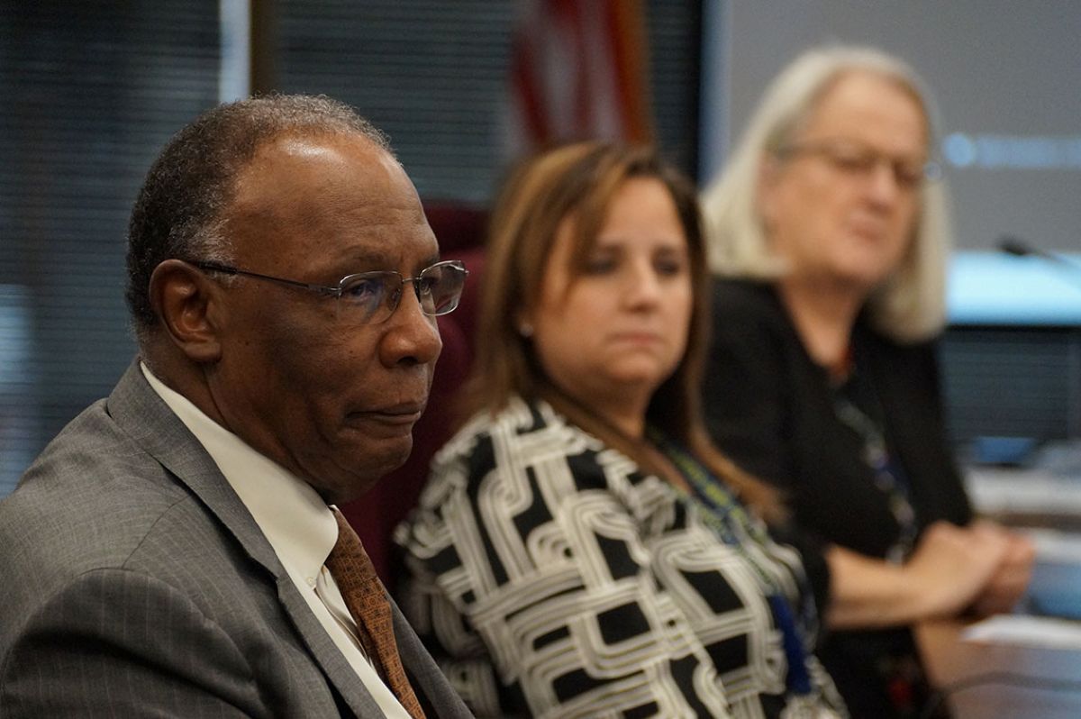 Illinois State Board of Education member James Anderson, left, listens to a presentation about budget challenges for PreK-12 education along with board members Laura Gonzalez and Patricia Nugent. (Capitol News Illinois photo by Peter Hancock)