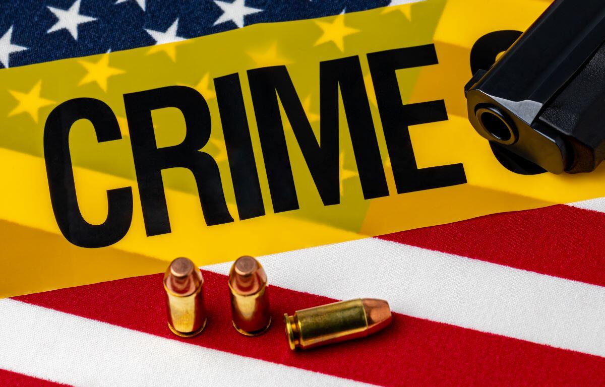 Crime tape with gun and ammo