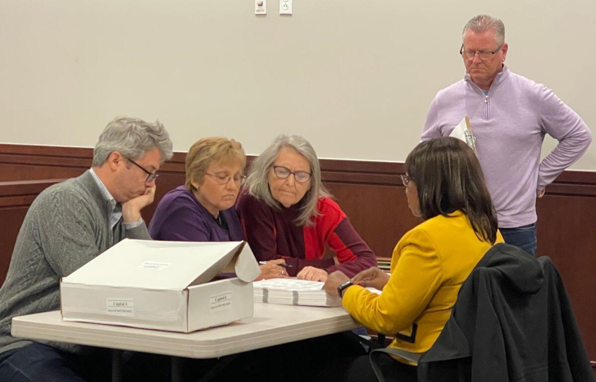 Josh Langfelder observes as representatives for both him and Frank Lesko review ballots during the discovery recount process on Dec. 11 at the Sangamon County Building