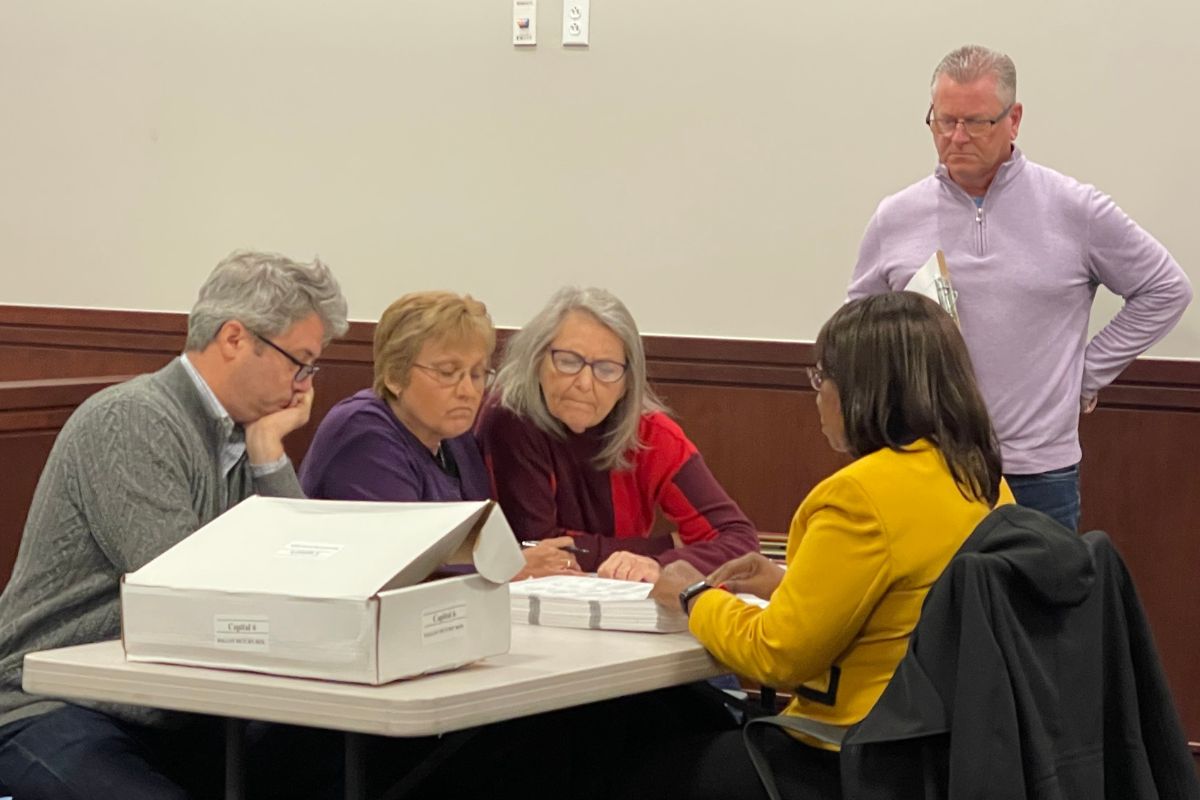 Josh Langfelder observes as representatives for both him and Frank Lesko review ballots during the discovery recount process on Dec. 11 at the Sangamon County Building