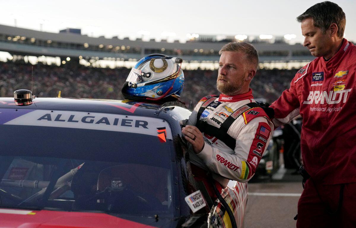 Driver Justin Allgaier gets in his car before a NASCAR Xfinity Series auto race, Saturday, Nov. 9, 2024, in Avondale, Ariz.