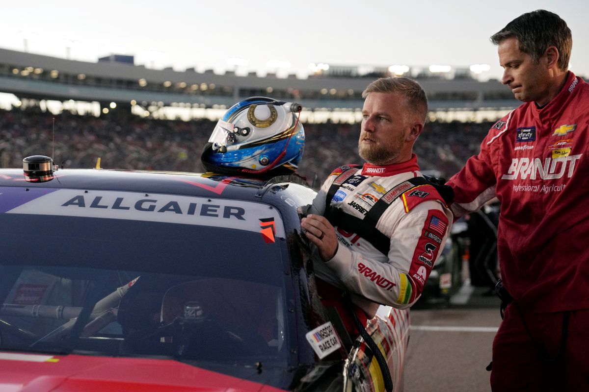 Driver Justin Allgaier gets in his car before a NASCAR Xfinity Series auto race, Saturday, Nov. 9, 2024, in Avondale, Ariz.