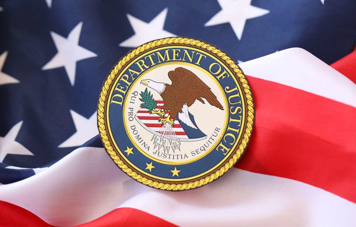 Dept. of Justice seal on U.S. flag