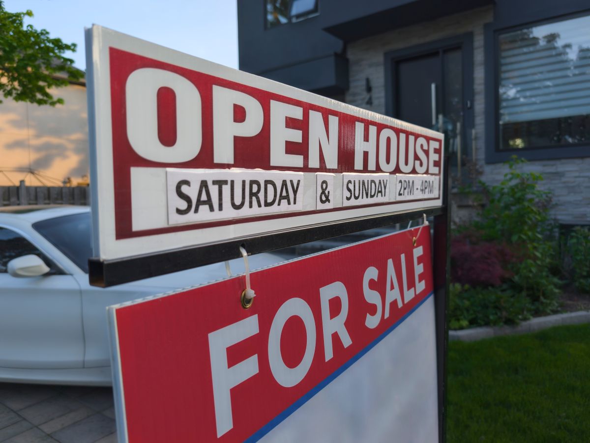 For Sale sign in front of home