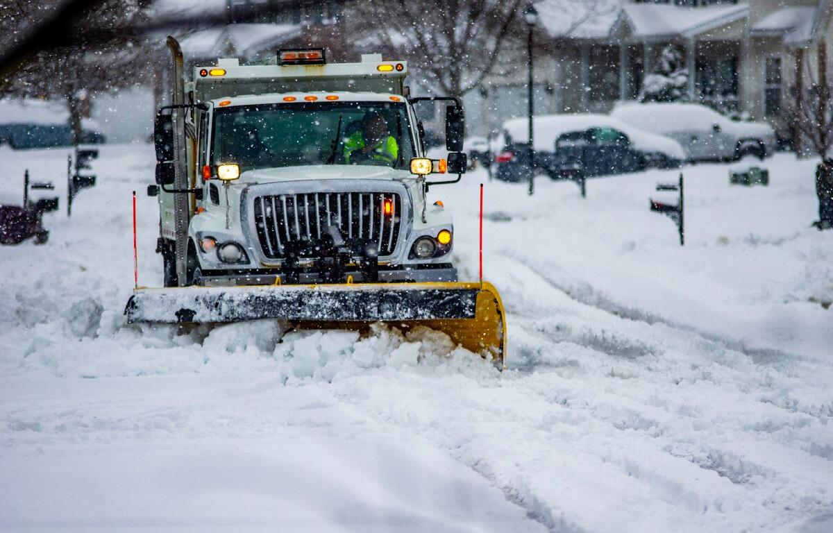 snow plow on city street