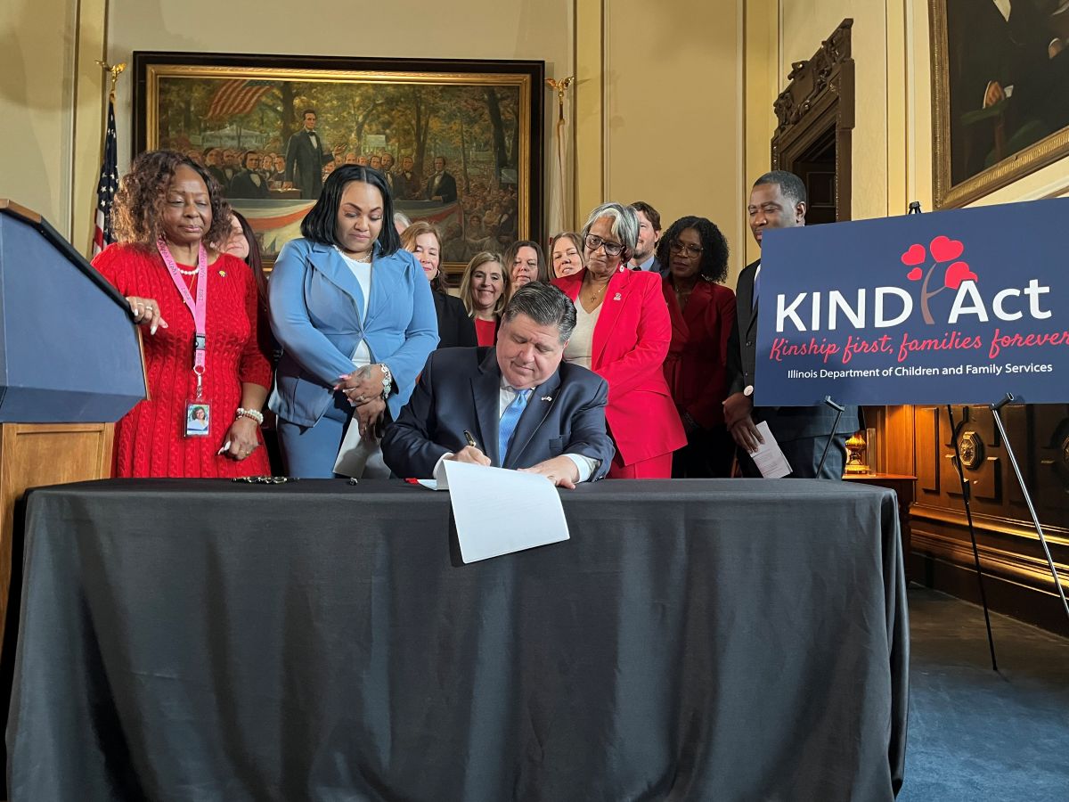 Gov. JB Pritzker signs the KIND Act Wednesday, Feb. 5, 2025, at the Illinois Capitol. The new law requires the state to prioritize family members when placing children in foster care. (Capitol News Illinois photo by Bridgette Fox)