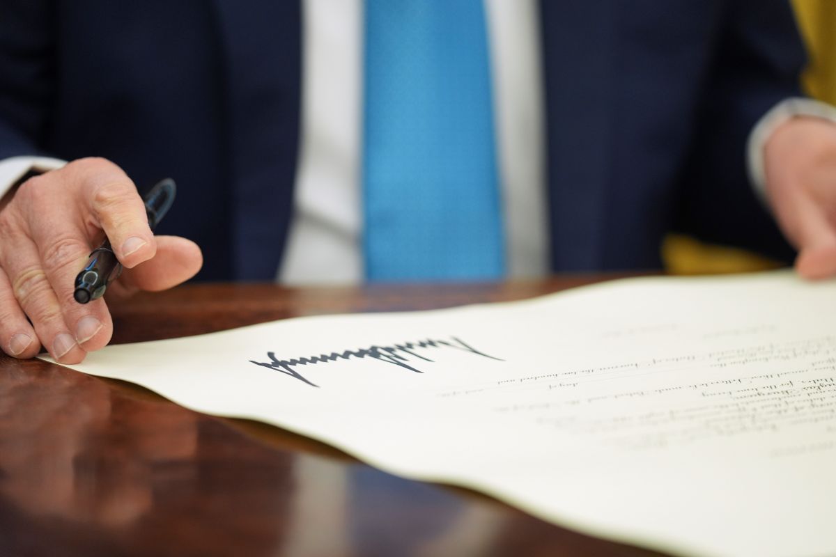 President Donald Trump pauses after signing an executive order in the Oval Office of the White House in Washington, Friday, Jan. 31, 2025. (AP Photo/Evan Vucci, File)
