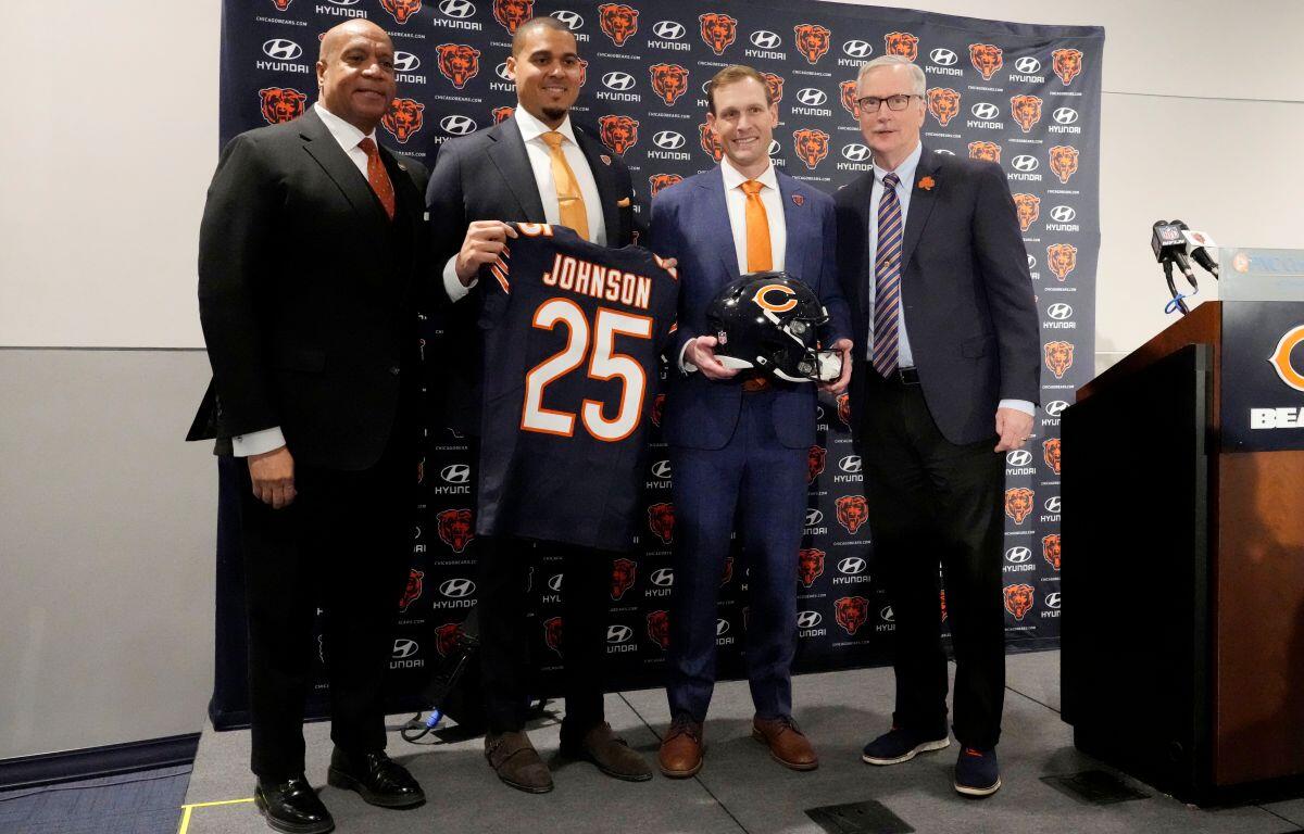 Chicago Bears President and CEO Kevin Warren, left, general manager Ryan Poles, second from left, new head coach Ben Johnson and team owner George McCaskey, right, pose for photo during an NFL football news conference at Halas Hall in Lake Forest, Ill., Wednesday, Jan. 22, 2025. (AP Photo/Nam Y. Huh)