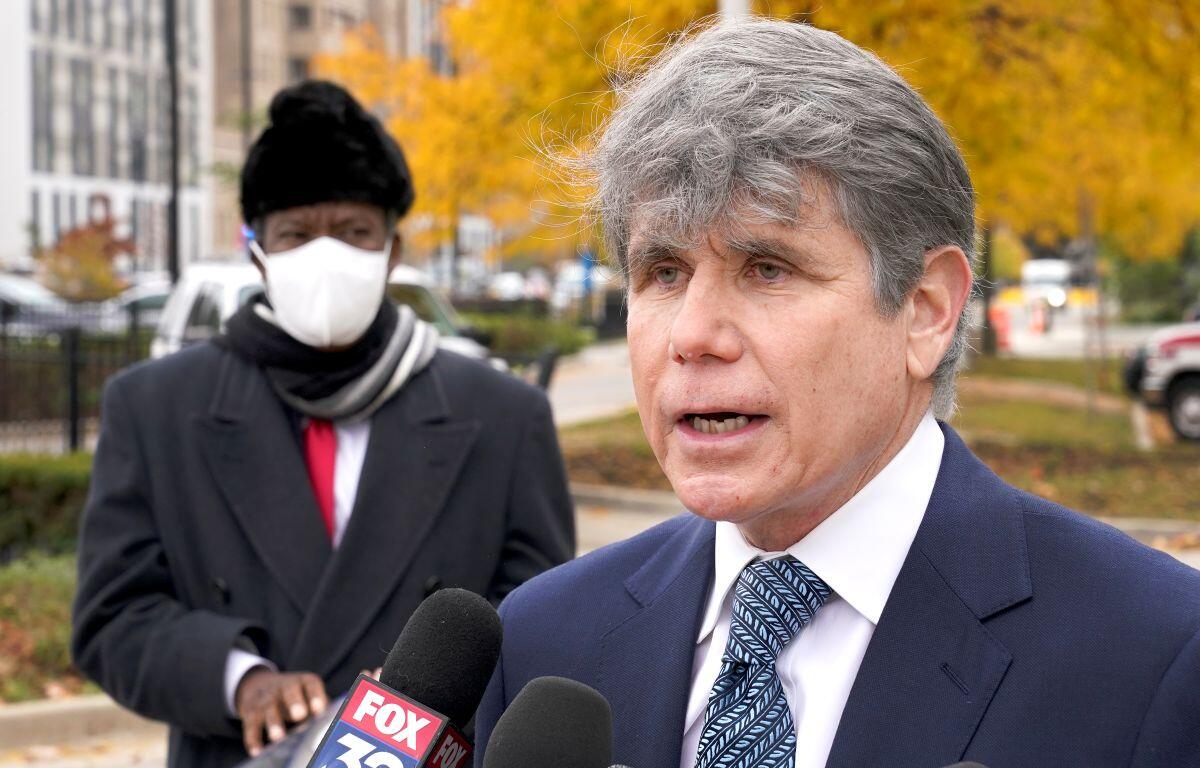Former Illinois Gov. Rod Blagojevich, right, speaks, Oct. 21, 2020, during a news conference in Chicago. (AP Photo/Charles Rex Arbogast, File)