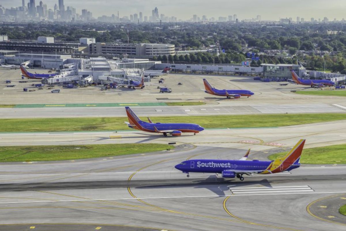 CHICAGO, UNITED STATES - SEPTEMBER 2015: Commercial Southwest Airlines jet landing on Chicago Midway Airport. Midway is second largest airport in Chicago, United States.