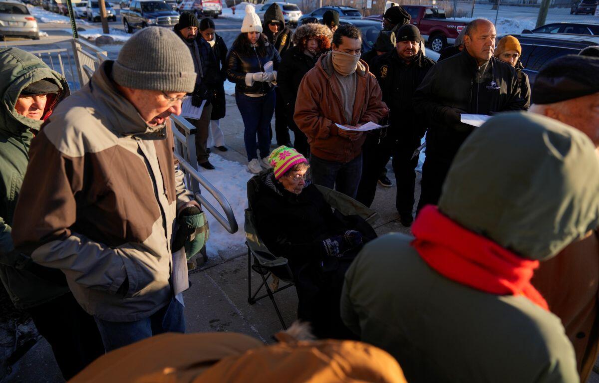 Sister JoAnn Persch, center, 90, a nun with the Sisters of Mercy, prays with others during a vigil outside a United States Immigration and Customs Enforcement detention facility Friday, Feb. 21, 2025, in Broadview, Ill. (AP Photo/Erin Hooley)