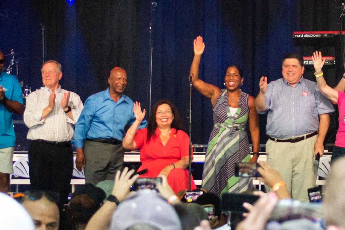 From left to right: Sen. Dick Durbin, former Secretary of State Jesse White, Sen. Tammy Duckworth, Lt. Gov. Juliana Stratton and Gov. JB Pritzker celebrate at Governor’s Day at the 2022 Illinois State Fair in Springfield. (Capitol News Illinois photo by Jerry Nowicki)
