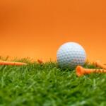 Golf ball and tees on course