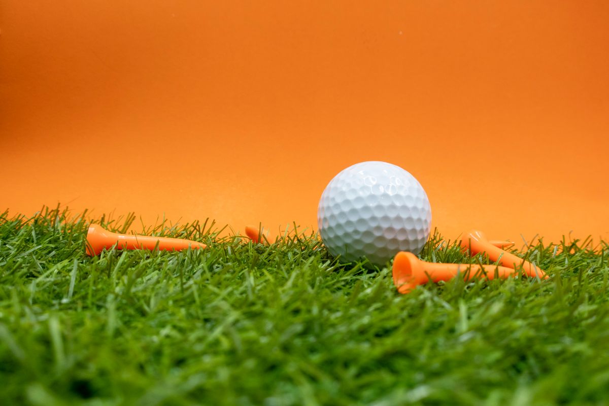 Golf ball and tees on course