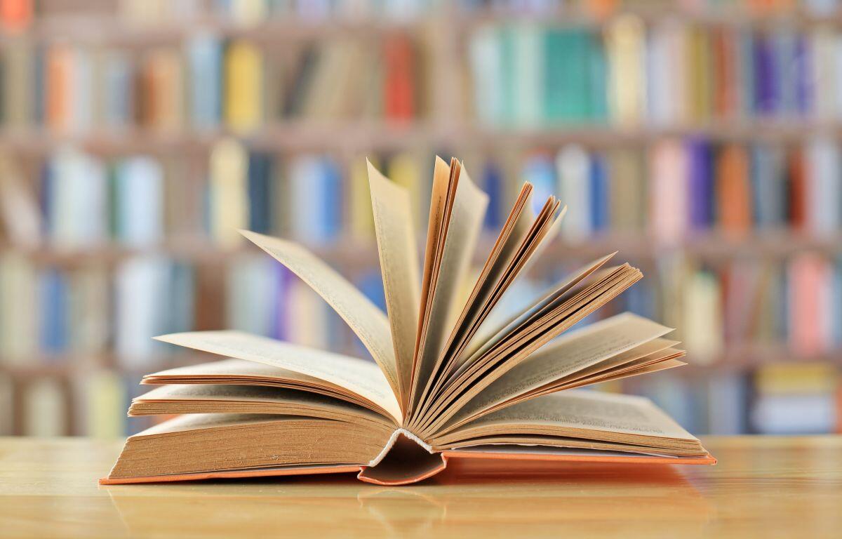 Library book with library in the background