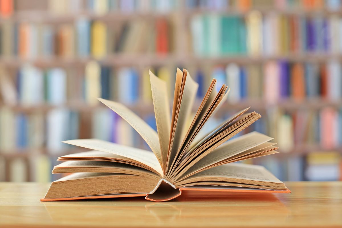 Library book with library in the background