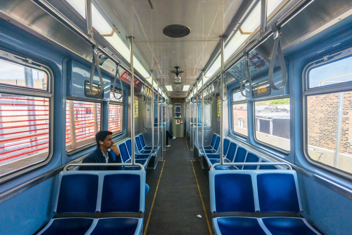 A couple of passengers ride a southbound Red Line “L” train in Chicago. (Capitol News Illinois photo by Andrew Adams)