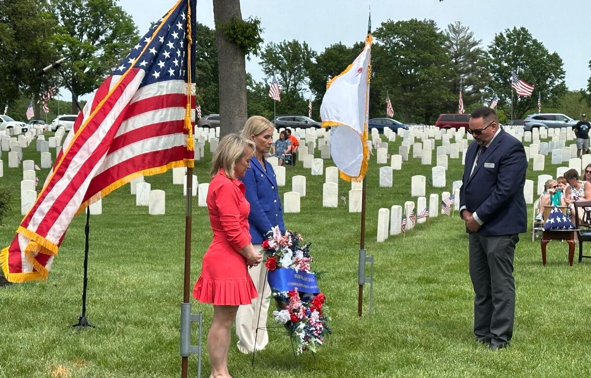 Reps. Nikki Budzinski (left, D-Springfield), and Mary Miller (R-Springfield), took part in a Memorial Day wreath-laying ceremony at Camp Butler National Cemetery.