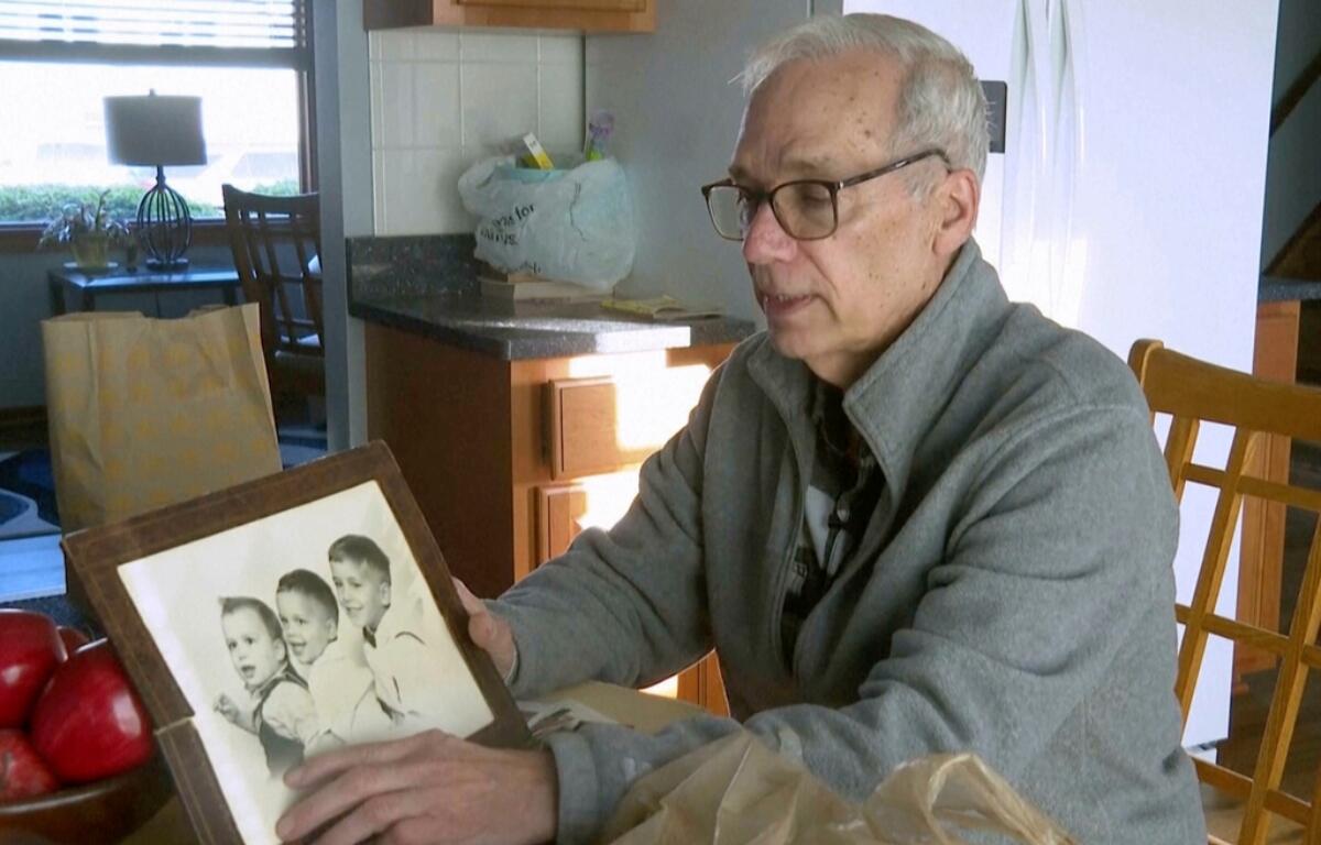 John Prevost points to an old photo of his brothers, including the newly elected Pope Leo XIV, Robert Prevost, left, during an interview with the Associated Press on Thursday, May 8, 2025, in New Lennox, Ill. (AP Photo/Obed Lamy) Screenshot