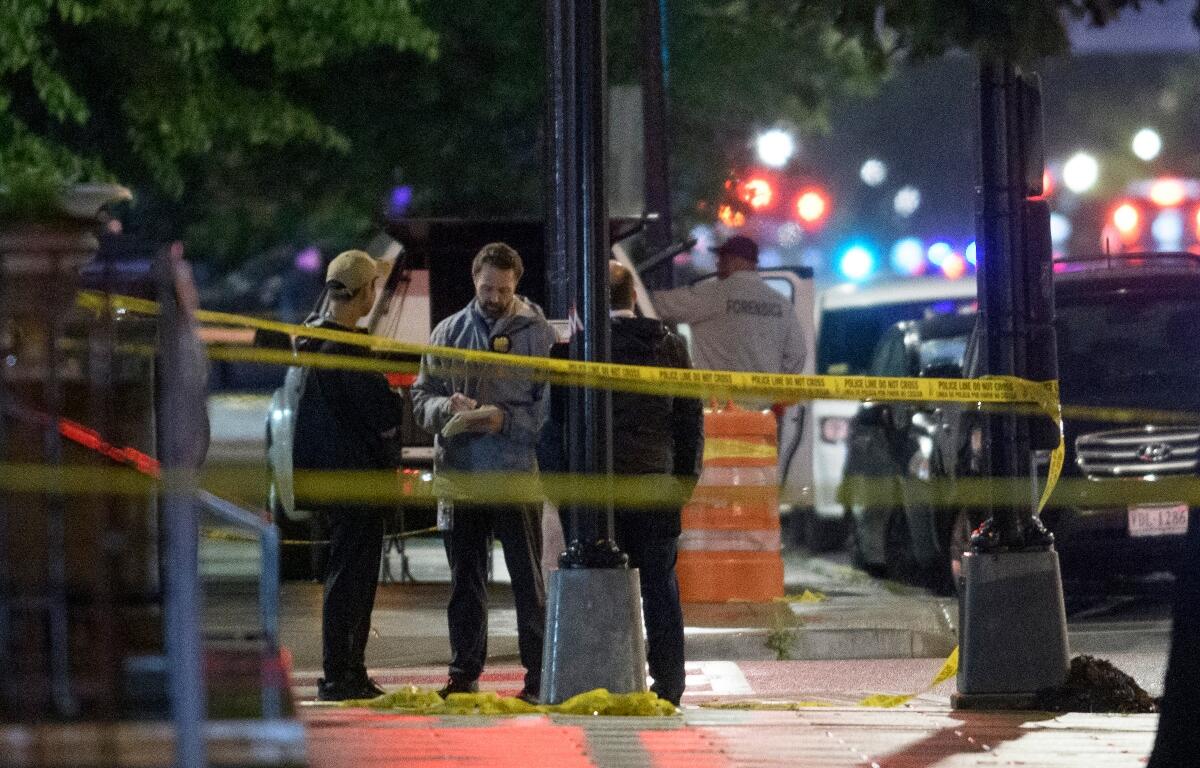 Law enforcement work the scene after two staff members of the Israeli Embassy in Washington were shot and killed outside the Capital Jewish Museum, Thursday, May 22, 2025, in Washington. (AP Photo/Rod Lamkey, Jr.)