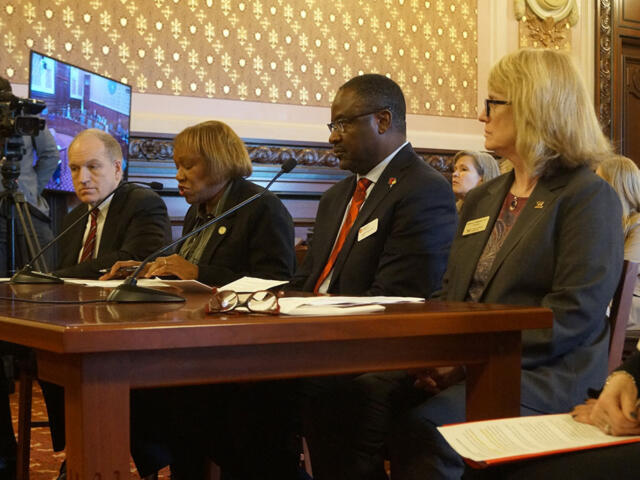 From left, Southern Illinois University System President Dan Mahony, along with Chicago State University President “Z” Scott, Illinois State University President Aondover Tarhule, and Western Illinois University President Kristi Mindrup testify before a Senate committee in favor of a bill creating a new funding formula for the state’s public universities. (Capitol News Illinois photo by Peter Hancock)
