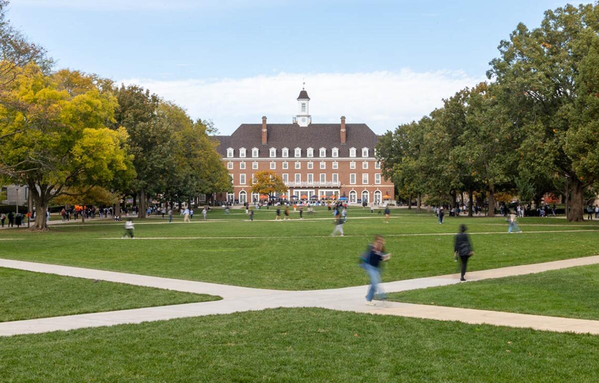 Students walk across the lawn between the Illini Union in the fall of 2024. (Capitol News Illinois photo by Andrew Adams)