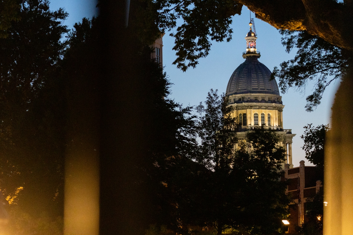 The Illinois Capitol, as seen from the lawn of the governor’s mansion a few blocks away in late May 2025. (Capitol News Illinois photo by Andrew Adams)