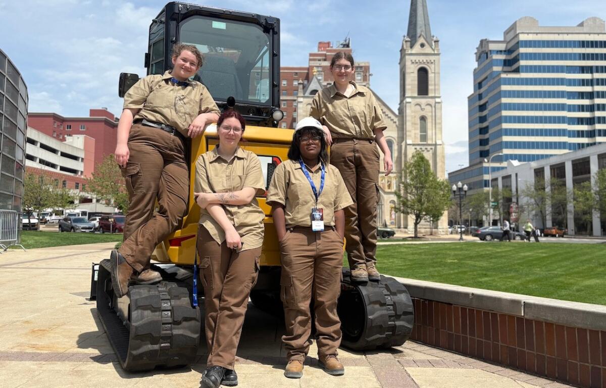 The first all-girls construction team to compete at SkillsUSA Illinois poses outside the Peoria Civic Center after their competition. From left, Aubrey Levin, Kayhl Miles, Amyla Walls and Catelin Wesley. (Medill Illinois News Bureau photo by Maggie Dougherty)