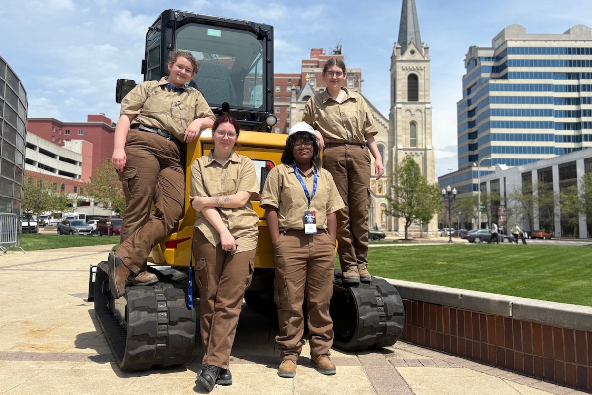 The first all-girls construction team to compete at SkillsUSA Illinois poses outside the Peoria Civic Center after their competition. From left, Aubrey Levin, Kayhl Miles, Amyla Walls and Catelin Wesley. (Medill Illinois News Bureau photo by Maggie Dougherty)