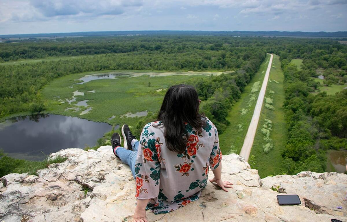 Machaela Sweeney enjoys the view at the top of Inspiration Point near the Mississippi River in southern Illinois’ Shawnee National Forest. (Medill Illinois News Bureau photo by Maggie Dougherty)