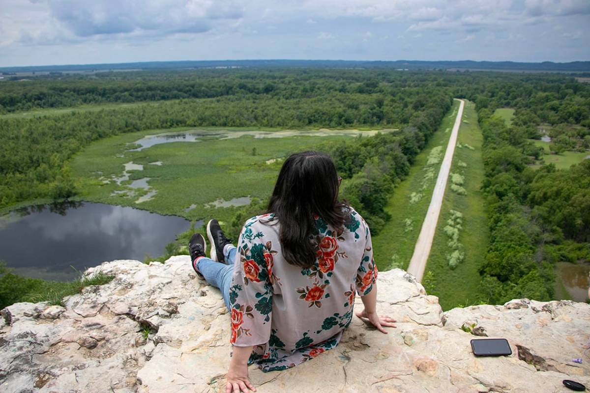 Machaela Sweeney enjoys the view at the top of Inspiration Point near the Mississippi River in southern Illinois’ Shawnee National Forest. (Medill Illinois News Bureau photo by Maggie Dougherty)