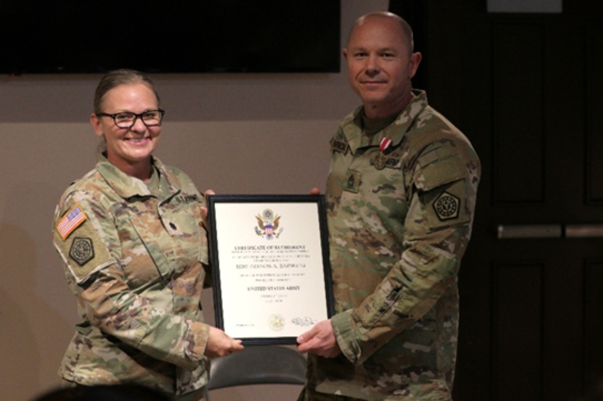 Lt. Col. Allison Jacobs, commander of the 634th Brigade Support Battalion, presents Master Sgt. Francis Sarnecki with a certificate of retirement during a ceremony held June 6 at the Illinois State Military Museum in Springfield. Sarnecki retired after 31 years of dedicated service in the Illinois Army National Guard, including two deployments in support of Operation Iraqi Freedom and 22 years with the Illinois Counterdrug Task Force. U.S. Army photo by Spc. Justin Malone, Illinois National Guard public affairs.