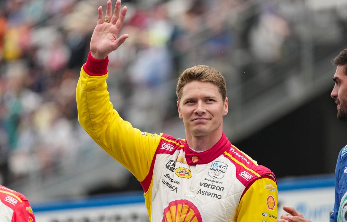 Josef Newgarden is introduced before the start of the Indianapolis 500 auto race at Indianapolis Motor Speedway in Indianapolis, Sunday, May 25, 2025. (AP Photo/AJ Mast)