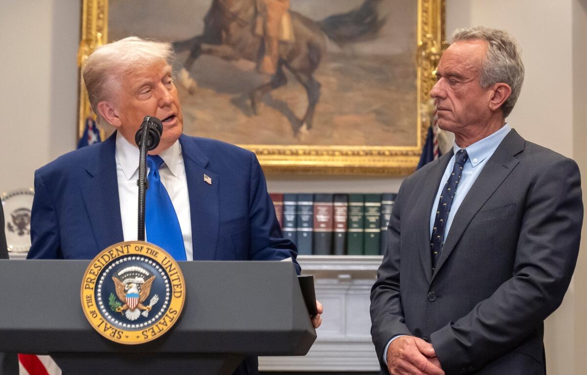 FILE - President Donald Trump, from left, speaks as Health and Human Services Secretary Robert F. Kennedy Jr., during an event in the Roosevelt Room at the White House, May 12, 2025, in Washington. (AP Photo/Mark Schiefelbein, File)\\\