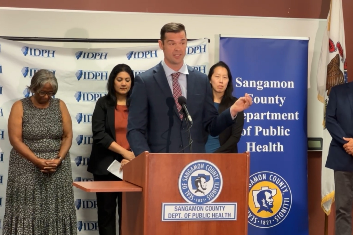 Ryan Croke, First Assistant Deputy Governor for Health and Human Services, speaks at a news conference in Springfield.