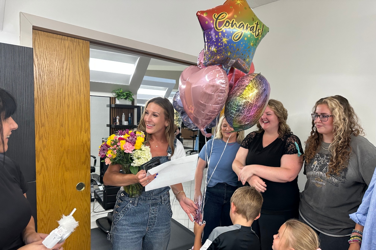 Lindsey Huff, BJ Grand Salon & Spa, is surprised with the 2nd Quarter 2025 WOW Award, presented by CILCSA and Capitol City Now!