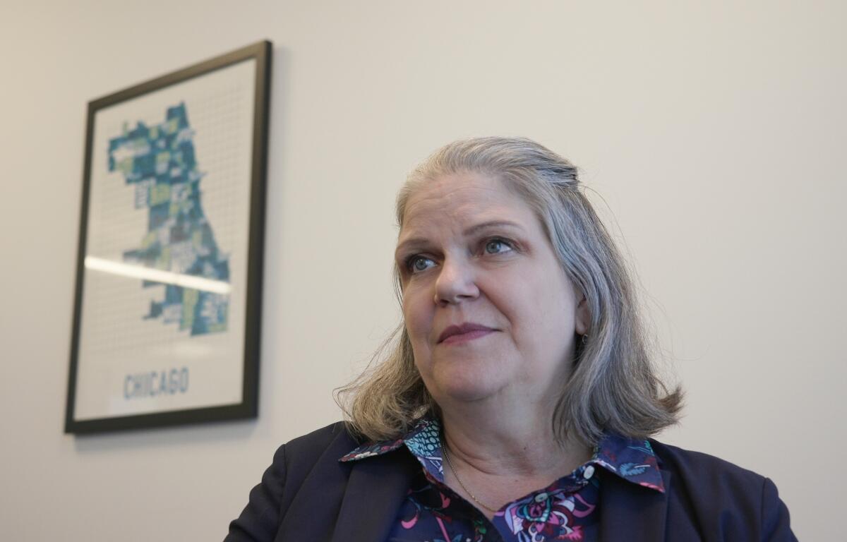 Jennifer Peyton sits for an interview in downtown Chicago on July 21, 2025. Peyton was fired from her position as Assistant Chief Immigration Judge on July 3rd, with no cause given. (AP Photo/Laura Bargfeld)