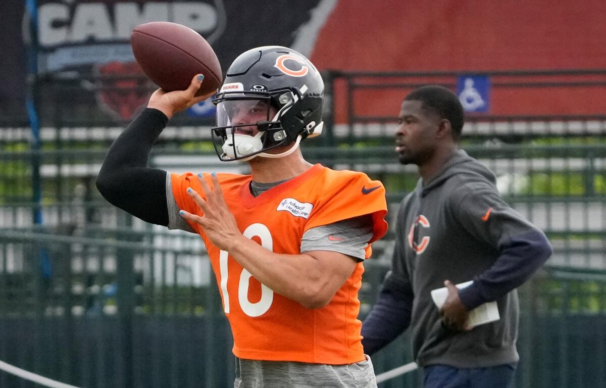 Chicago Bears quarterback Caleb Williams (18) throws the ball at practice during Back Together training camp event for fans on Saturday, July 26, 2025, in Lake Forest, Ill. (AP Photo/David Banks)