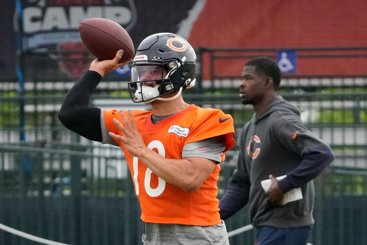 Chicago Bears quarterback Caleb Williams (18) throws the ball at practice during Back Together training camp event for fans on Saturday, July 26, 2025, in Lake Forest, Ill. (AP Photo/David Banks)