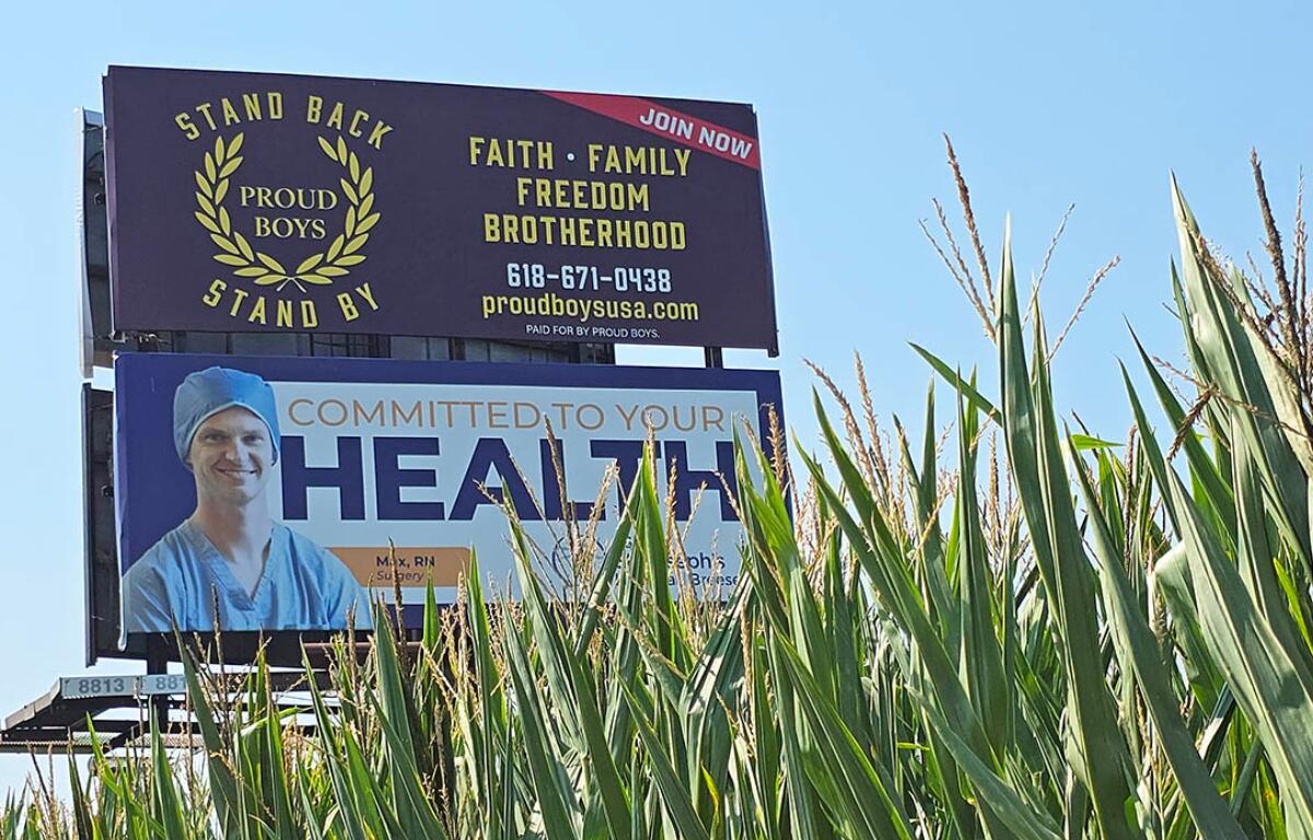 A billboard promoting the Proud Boys, a right-wing extremist group, appears in a cornfield in Clinton County, Illinois. (Molly Parker/CNI)