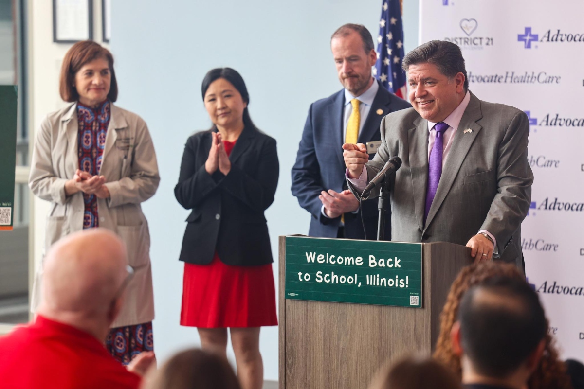 Gov. JB Pritzker participates in a news conference about the effectiveness of vaccines.