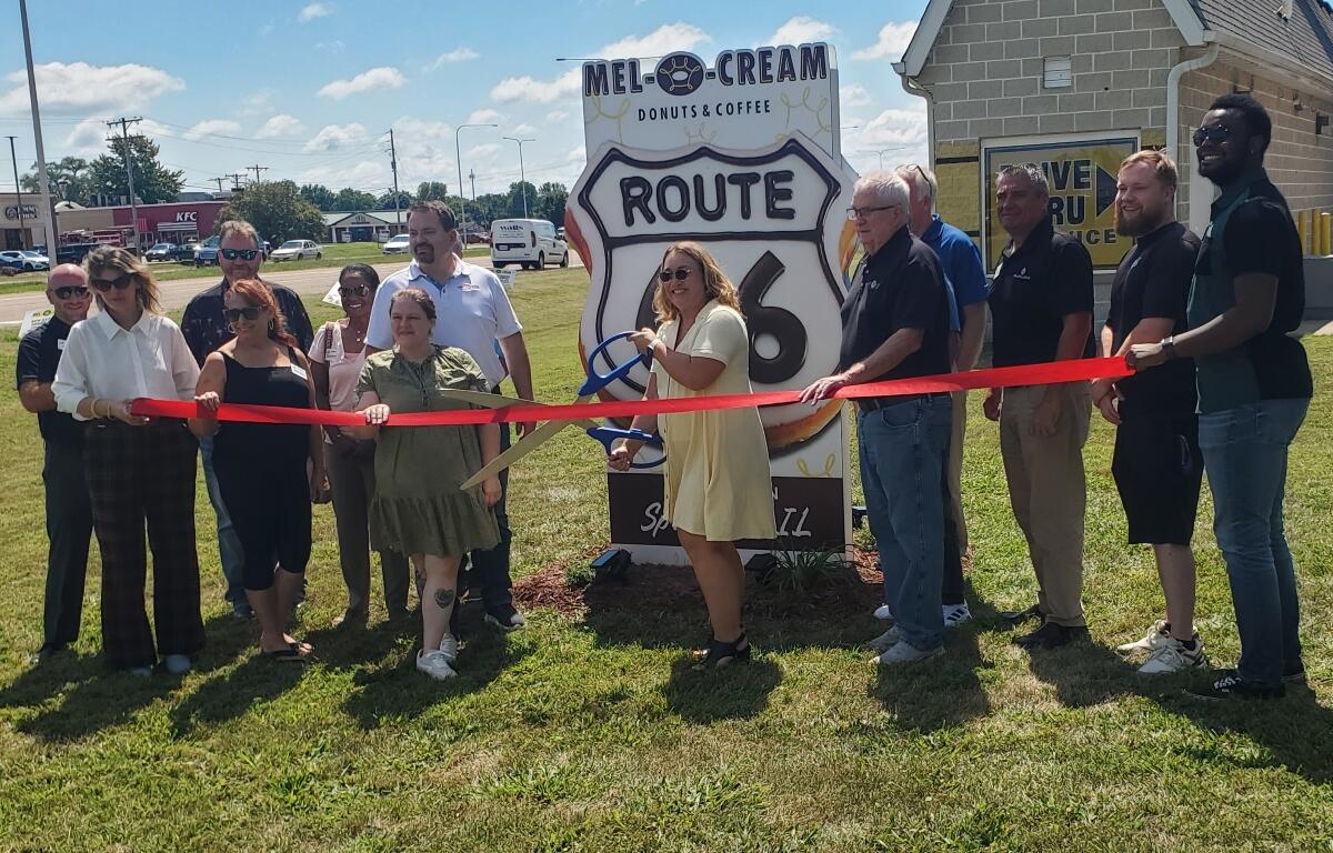 The new Route 66 donut sign was the subject of a ribbon-cutting Wednesday outside Mel-o-Cream on 6th Street.