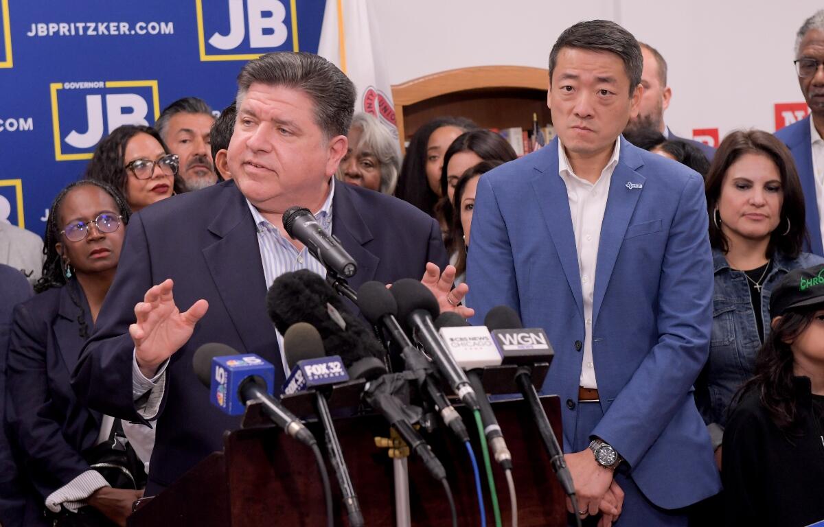 Texas House Democrats join Illinois Governor JB Pritzker speaks about the Texas Republican plans to redraw the House map during a press conference at the Democratic Party of DuPage County office in Carol Stream, IL on Sunday, Aug. 3, 2025. (AP Photo/Mark Black)